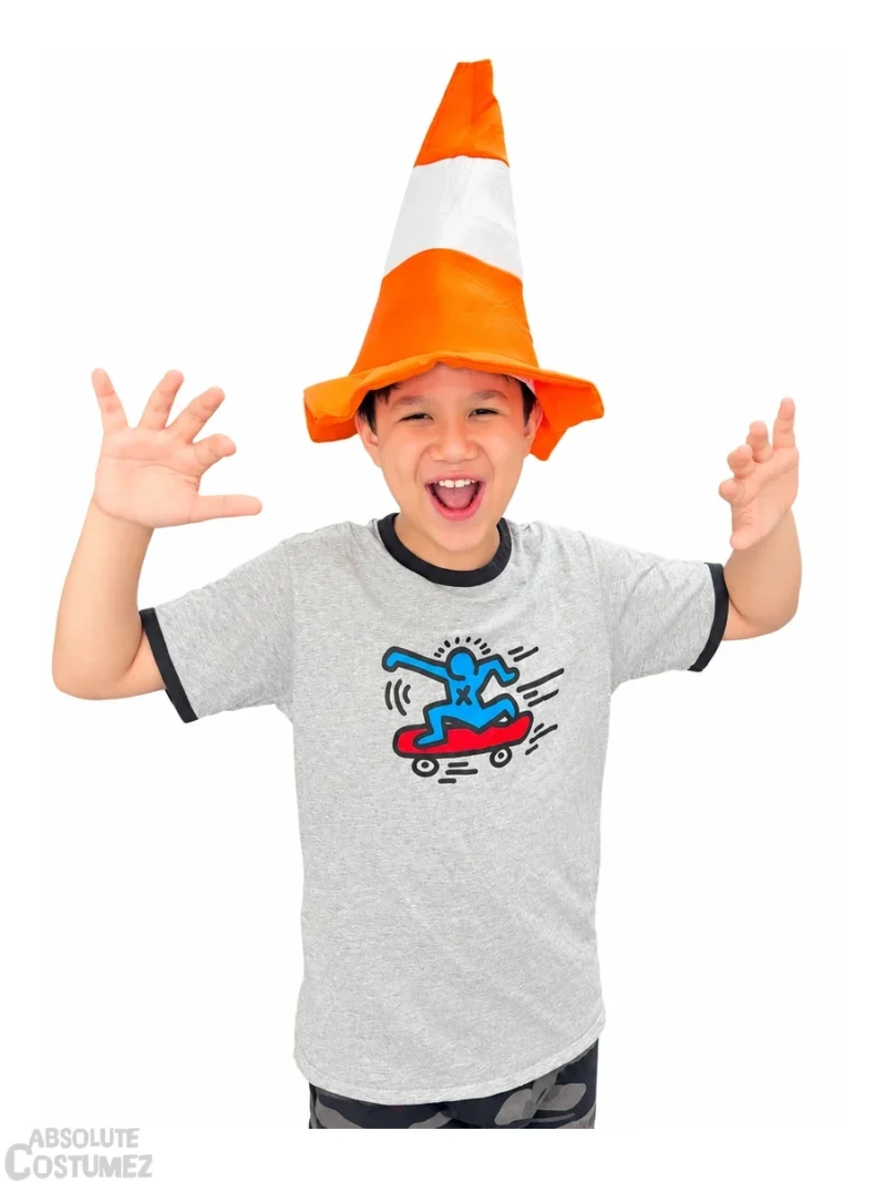 Boy wearing traffic cone funny hat with excited expression